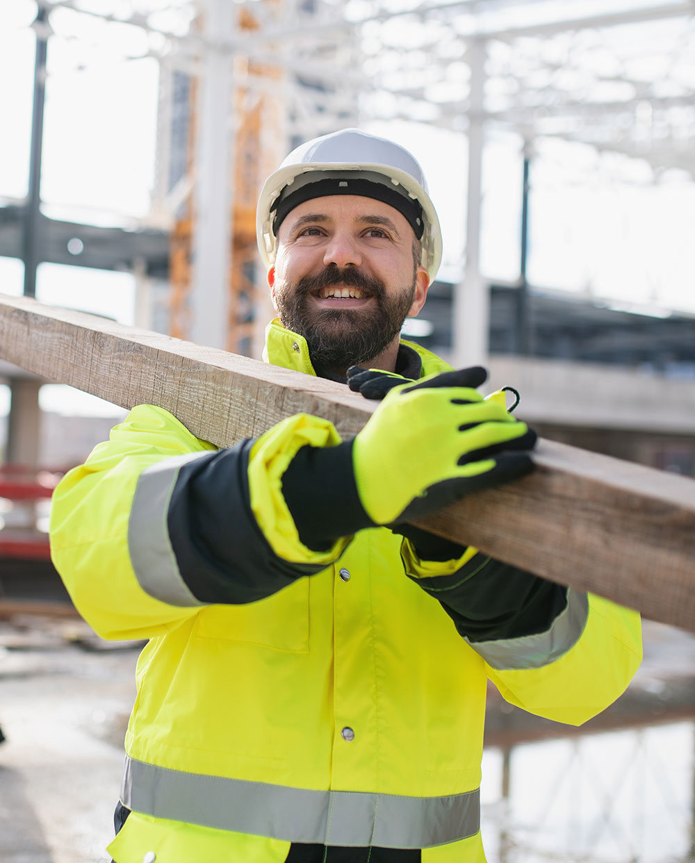 Worker caring a beam