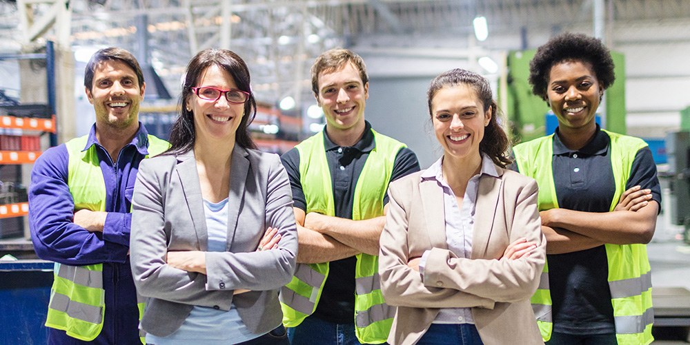 Group of TRICOR employees and manufacturing workers