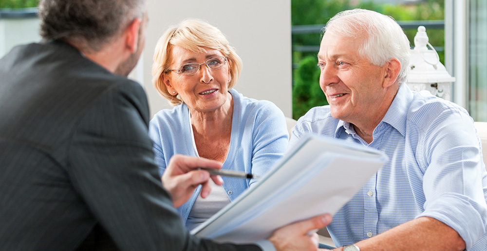 a TRICOR medicare supplement specialist speaks with a elderly couple