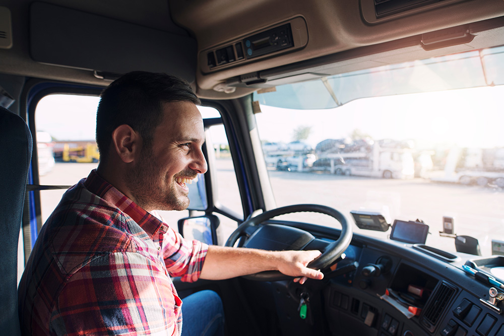 Semi truck driver in his cab